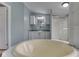 Primary bath features a large soaking tub, shower, and custom cabinetry with dual vanities at 5964 N Pr Wind Drift Ln, Shelbyville, IN 46176