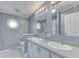 Bathroom with double sinks and white cabinets at 5964 N Pr Wind Drift Ln, Shelbyville, IN 46176