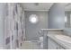 Bathroom with a shower curtain and octagon window at 5964 N Pr Wind Drift Ln, Shelbyville, IN 46176