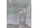 Bedroom leading into the bathroom with wood-look floors at 5964 N Pr Wind Drift Ln, Shelbyville, IN 46176