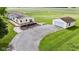 Exterior of the home and the detached garage, showcasing the home's features and outdoor space at 5964 N Pr Wind Drift Ln, Shelbyville, IN 46176
