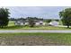 View of the front of the house and detached garage on a large landscaped lot at 5964 N Pr Wind Drift Ln, Shelbyville, IN 46176