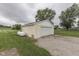 Detached one car garage with gravel driveway and external mounted propane tank at 5964 N Pr Wind Drift Ln, Shelbyville, IN 46176