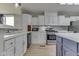 Updated kitchen features stainless appliances, modern backsplash, and beautiful countertop and floors at 5964 N Pr Wind Drift Ln, Shelbyville, IN 46176