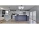 Bright eat-in kitchen with stainless appliances, large island, and lovely backsplash and flooring at 5964 N Pr Wind Drift Ln, Shelbyville, IN 46176