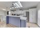 Bright eat-in kitchen with stainless appliances, large island, and lovely backsplash and flooring at 5964 N Pr Wind Drift Ln, Shelbyville, IN 46176