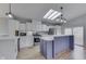 Bright eat-in kitchen with stainless appliances, large island, and lovely backsplash and flooring at 5964 N Pr Wind Drift Ln, Shelbyville, IN 46176