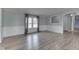 Bright living room featuring wood-look floors and plenty of natural light at 5964 N Pr Wind Drift Ln, Shelbyville, IN 46176