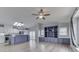 Open floor plan with eat-in kitchen, living room featuring built-in cabinets and modern windows at 5964 N Pr Wind Drift Ln, Shelbyville, IN 46176