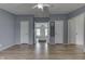Spacious primary bedroom with modern paint and flooring with an ensuite bathroom and walk in closet at 5964 N Pr Wind Drift Ln, Shelbyville, IN 46176