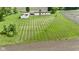 Aerial view showing home, garage, and a large lot with a neatly mowed lawn at 5964 N Pr Wind Drift Ln, Shelbyville, IN 46176