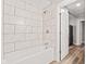 This bathroom features a shower and bath with tile surround at 6029 English Ave, Indianapolis, IN 46219