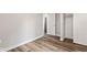 Bedroom featuring a closet and wood-look flooring at 6029 English Ave, Indianapolis, IN 46219