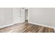 This bedroom features hardwood floors, fresh paint, and ample natural light at 6029 English Ave, Indianapolis, IN 46219