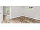 Bedroom featuring light gray walls and wood-look flooring at 6029 English Ave, Indianapolis, IN 46219