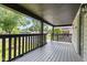 View of the neighborhood from the expansive covered front porch at 6029 English Ave, Indianapolis, IN 46219