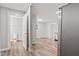 Living room boasts a modern bathroom, sleek appliances, and stylish gray walls at 6029 English Ave, Indianapolis, IN 46219
