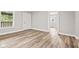 Inviting living room with light gray walls and wood-look flooring at 6029 English Ave, Indianapolis, IN 46219