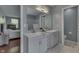 Bathroom with double sinks, walk-in shower, and white tile at 6214 Weller Cir, Indianapolis, IN 46268