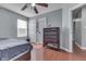 Bedroom featuring hardwood floors, large window, and view to another room at 6214 Weller Cir, Indianapolis, IN 46268