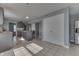 Bright kitchen featuring a tile floor, kitchen island, and stainless steel appliances at 6214 Weller Cir, Indianapolis, IN 46268