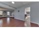 Open-concept living area with hardwood floors and a seamless flow to the rest of the house at 6214 Weller Cir, Indianapolis, IN 46268
