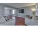 Spacious living room with hardwood floors, a television and access to other rooms at 6214 Weller Cir, Indianapolis, IN 46268