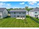 Aerial view showcases the well-manicured backyard with an inviting patio seating area at 633 Cowley Dr, Westfield, IN 46074
