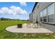 View of backyard patio with outdoor seating, grill, and fire pit, perfect for relaxing and entertaining outdoors at 633 Cowley Dr, Westfield, IN 46074