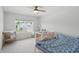 Bright bedroom featuring a crib and a comfortable bed next to a large window at 633 Cowley Dr, Westfield, IN 46074