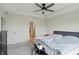 Well-lit bedroom showcasing tray ceilings and a comfortable bed, creating a serene retreat at 633 Cowley Dr, Westfield, IN 46074