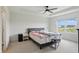 Bright bedroom with a large window, comfortable bed, and neutral decor at 633 Cowley Dr, Westfield, IN 46074
