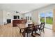 Open concept dining room and living room with a fireplace and a view of the backyard at 633 Cowley Dr, Westfield, IN 46074