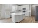 Modern kitchen with white cabinets, quartz countertops, and stainless steel appliances at 633 Cowley Dr, Westfield, IN 46074