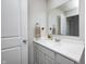 Clean bathroom features a single sink vanity, white cabinets, and a decorative hand towel at 6332 Card Blvd, Indianapolis, IN 46221