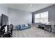 Cozy bedroom with blue walls, carpeted floors and a comfortable blue cushion bed for lounging at 6332 Card Blvd, Indianapolis, IN 46221