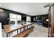 Spacious dining area with long wooden table and easy access to the living room and kitchen at 6332 Card Blvd, Indianapolis, IN 46221