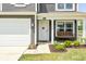 Charming front porch with a swing, a white front door with the house number, and a well-manicured lawn at 6332 Card Blvd, Indianapolis, IN 46221