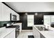 Well-lit kitchen with white cabinets, modern appliances, and ample counter space at 6332 Card Blvd, Indianapolis, IN 46221