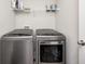 Efficient laundry room featuring modern silver washer and dryer units, maximizing space and convenience at 6332 Card Blvd, Indianapolis, IN 46221