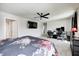 Tranquil bedroom with ceiling fan and attached bath, offering a serene personal space at 6332 Card Blvd, Indianapolis, IN 46221