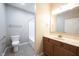 Bathroom featuring a toilet, vanity, and shower/tub combo at 6586 Quail Run, Fishers, IN 46038