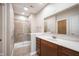 Bathroom featuring a large vanity with modern fixtures and a walk-in shower at 6586 Quail Run, Fishers, IN 46038