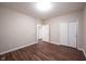 Bedroom with wood floors, a window for natural light, and closet for storage at 6586 Quail Run, Fishers, IN 46038