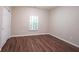 Bedroom featuring wood floors, natural light from the window, and a closet at 6586 Quail Run, Fishers, IN 46038