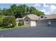 Home exterior with stone and siding, complemented by an attached two-car garage at 6586 Quail Run, Fishers, IN 46038