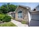Charming house featuring stone accents and manicured landscaping at 6586 Quail Run, Fishers, IN 46038