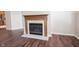 Bright living room featuring a classic fireplace and new hardwood flooring at 6586 Quail Run, Fishers, IN 46038