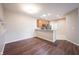 Spacious living space with vinyl flooring, kitchen view, and ample natural light at 6586 Quail Run, Fishers, IN 46038
