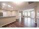 Open-concept living space showcasing kitchen, fireplace, and ample natural light at 6586 Quail Run, Fishers, IN 46038